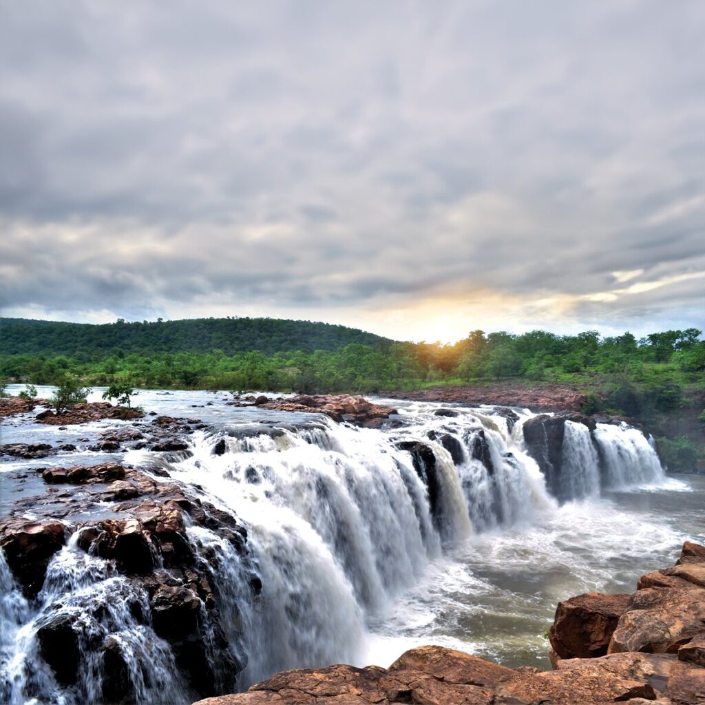 Bogatha Waterfall cascading through lush green forests in Mulugu district, Telangana